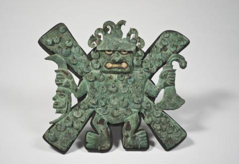 Forehead ornament representing the 'decapitator' God, bronze